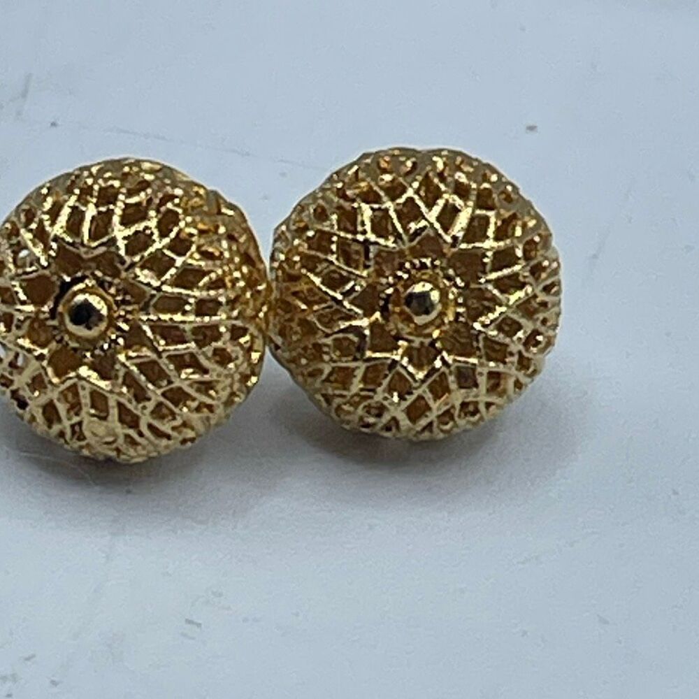 Vintage Monet filigree raised hollow gold plated pierced earrings.